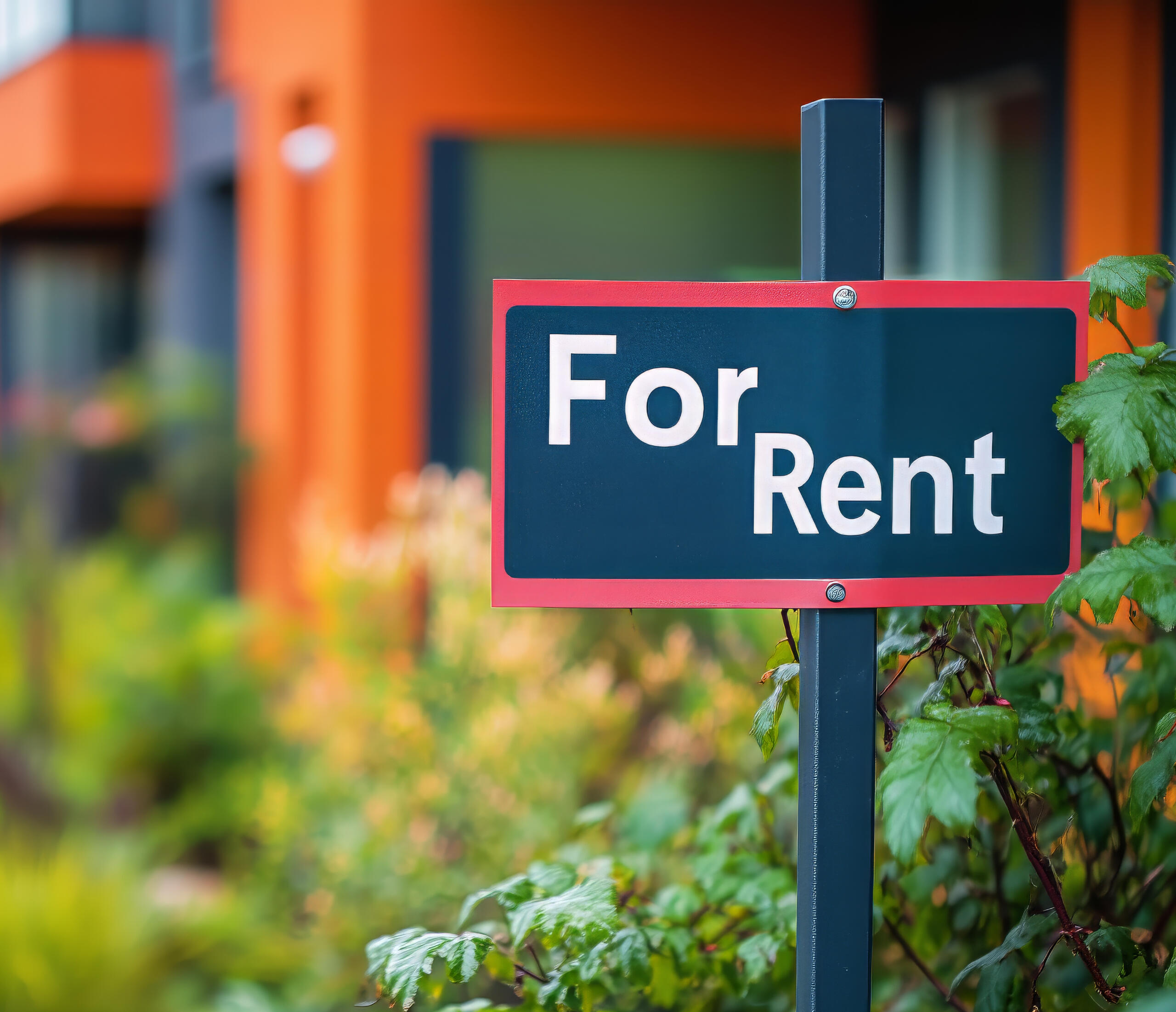 For rent sign in front of apartment building